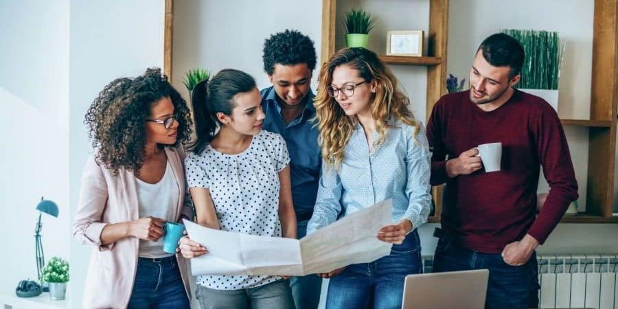 Group of market researchers discuss project plan for large research project