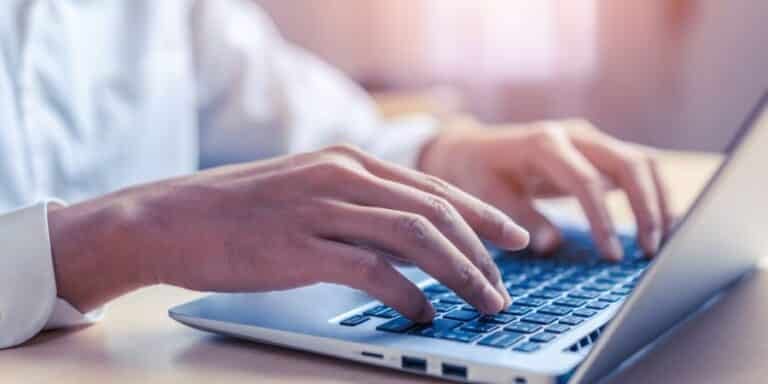 A man participating in user testing through a laptop.