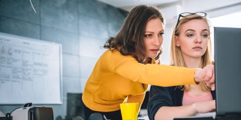 Two female market researchers work on market research screener