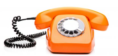 Orange telephone with dial