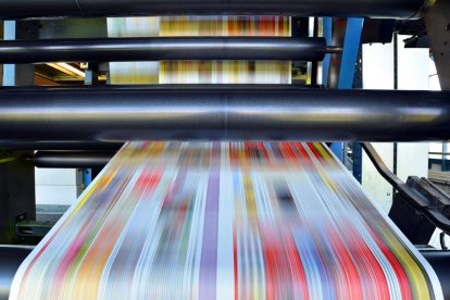 Commercial printing press in action
