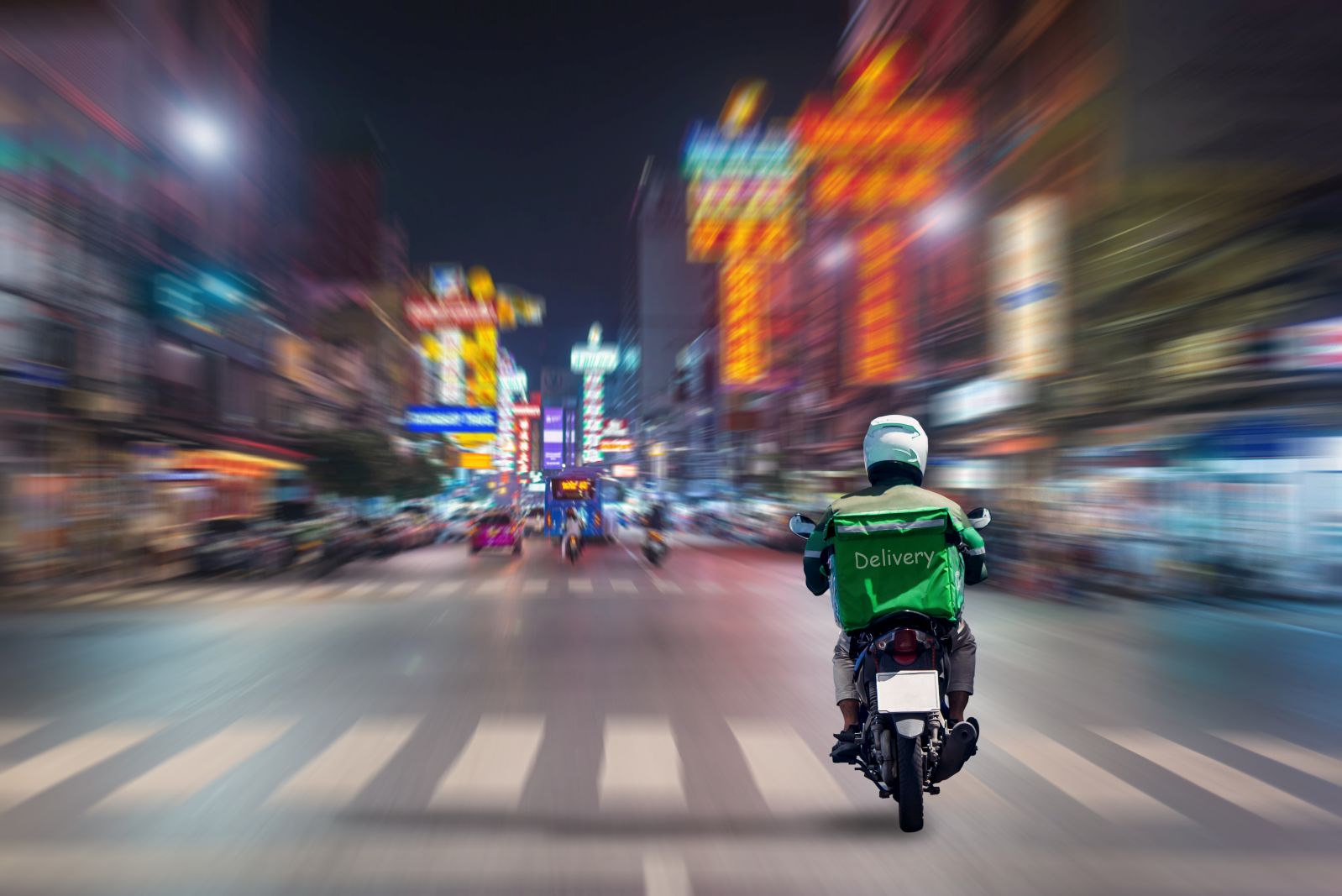 Food delivery driver on motorbike