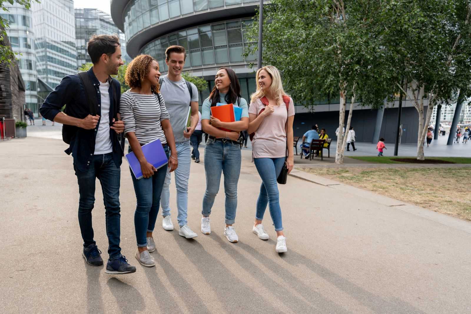 Diverse group of students walking along a London street