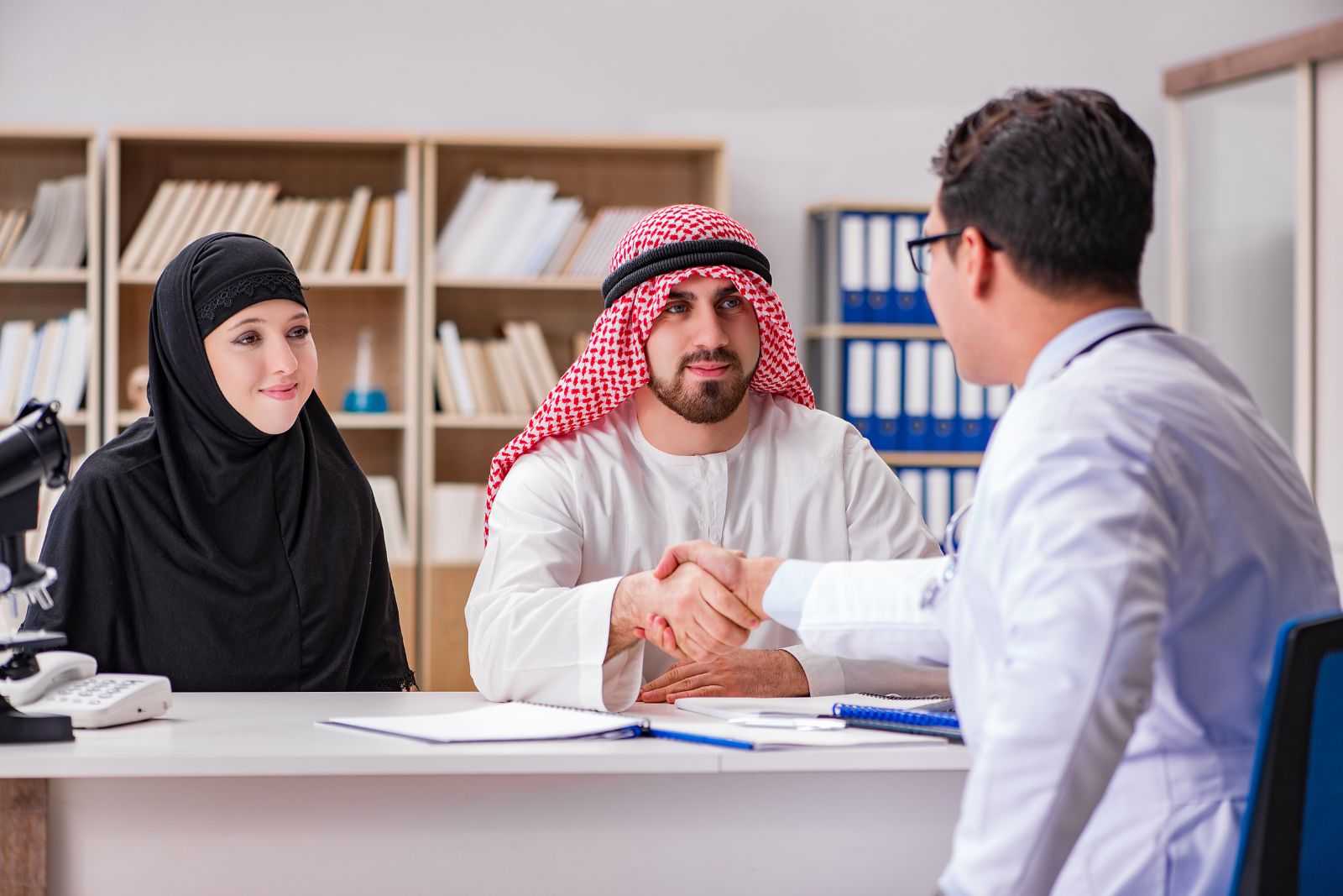 Arab couple consulting a doctor