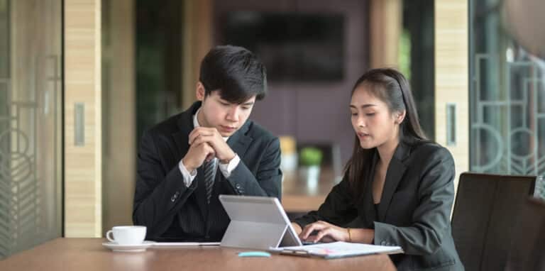 East Asian moderator conducting customer experience test with female customer