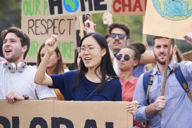 Climate protesters carrying placards on a march