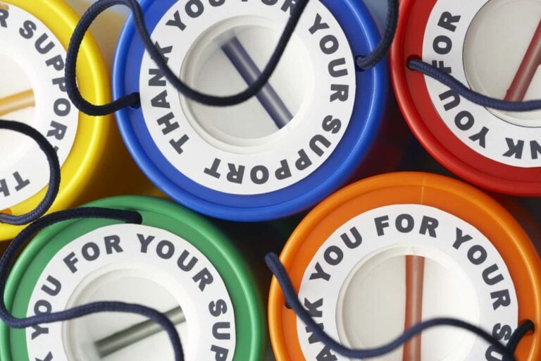 colourful charity cash collection boxes raising money for worthy cause
