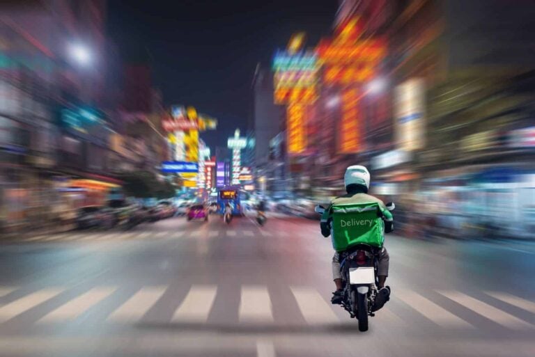 Food delivery drivers are driving to deliver products to customers who order online. Impact of epidemics