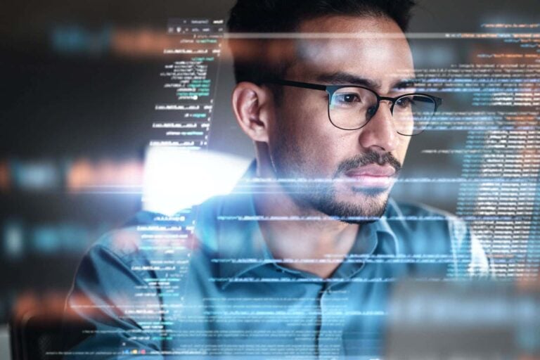 IT security manager focusing on business data with hologram and data analytics