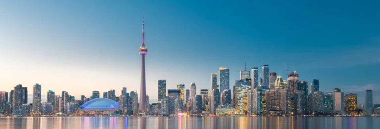 Toronto, Canada - City skyline at dusk, viewed from Lake Ontario, with CN tower in the centre