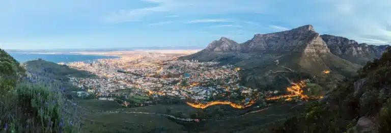 Cape Town, South Africa - panorama of the city at dusk with Table Mountain clearly visible on the right