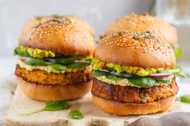 tray of vegetarian burgers in buns served in quick service fast food restaurant