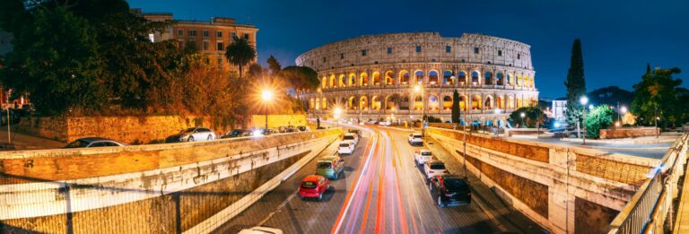 Rome, Italy - night-time view with the Colsseum lit up in the background