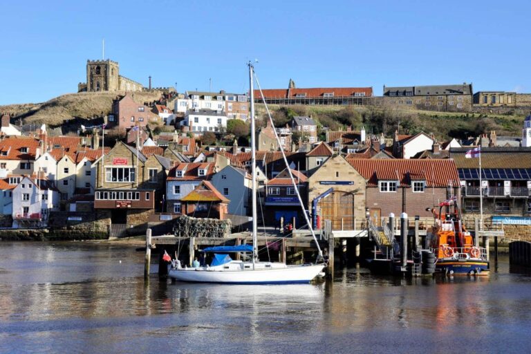whitby, yorkshire harbourfront on a sunny day