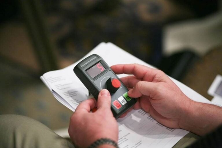 close up of market research participant taking part in dial test dialsmith inc