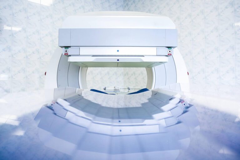 Gamma camera being set up for a patient in a hospital setting