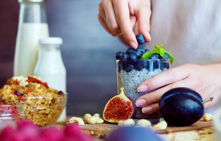 Healthy fitness food for breakfast including figs, fruit, yoghurt, chia seeds