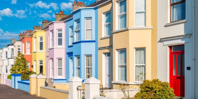 A row of brightly coloured terraced houses in the UK