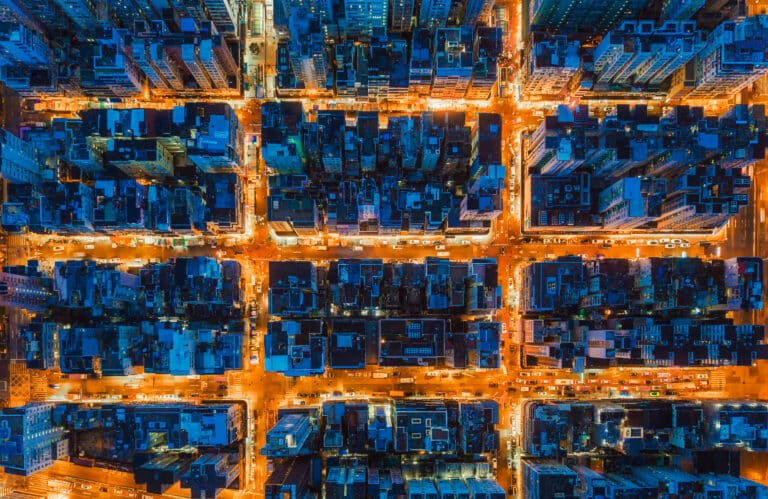 Twelve blocks of high-rise city centre viewed from overhead at night