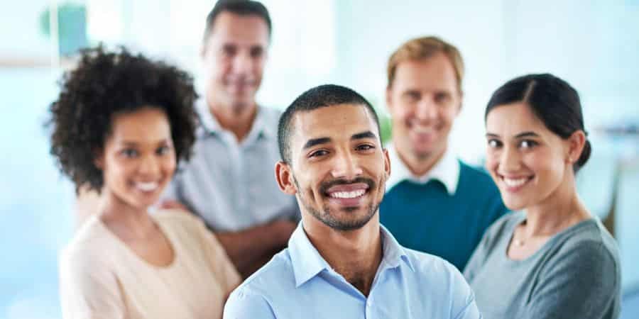 Group of market research respondents standing smiling