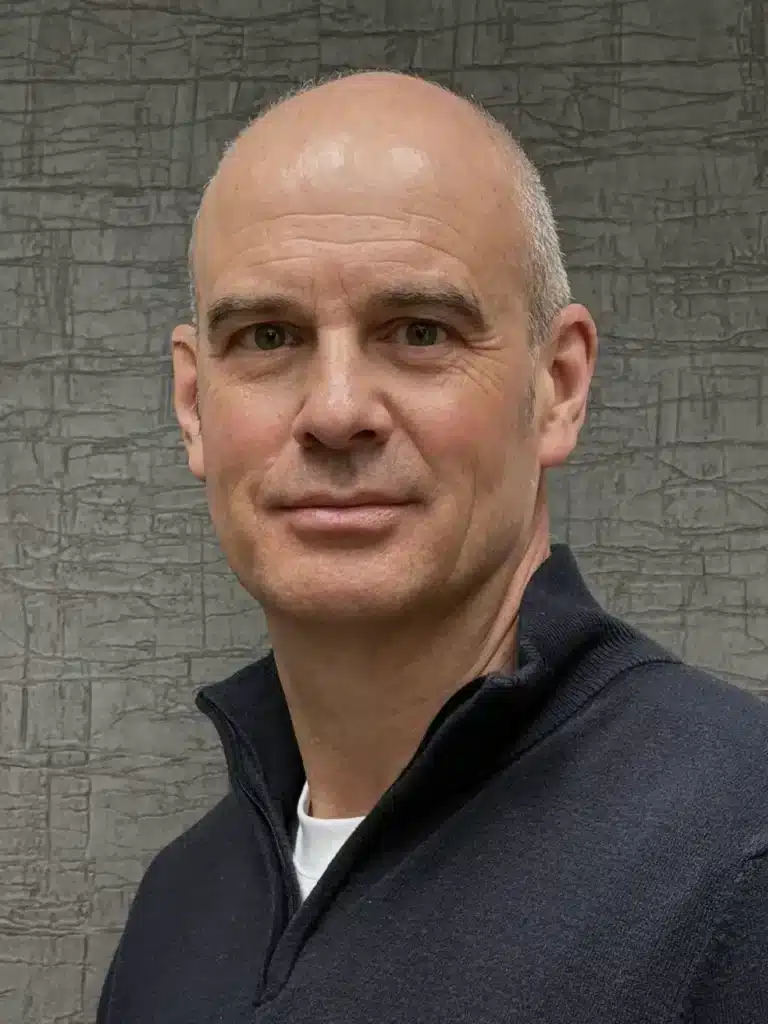 Formal business portrait of Philip Bates