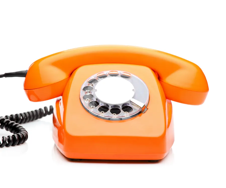 Retro orange telephone with dial