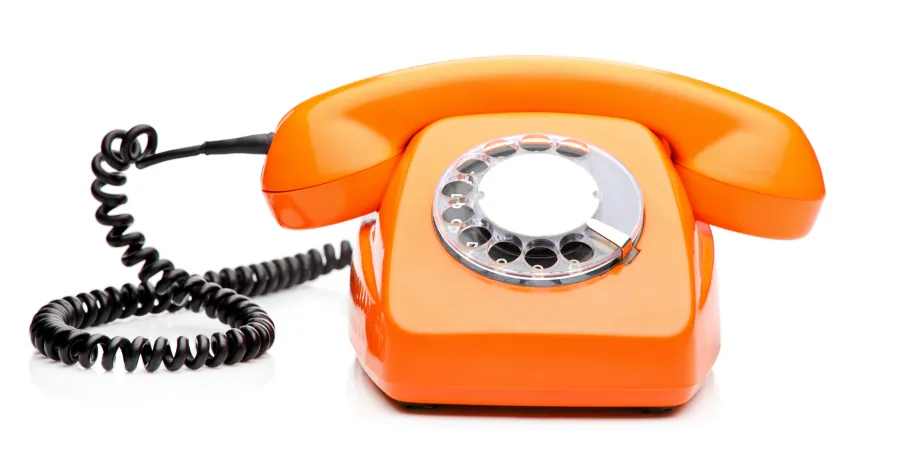 Retro orange telephone with dial
