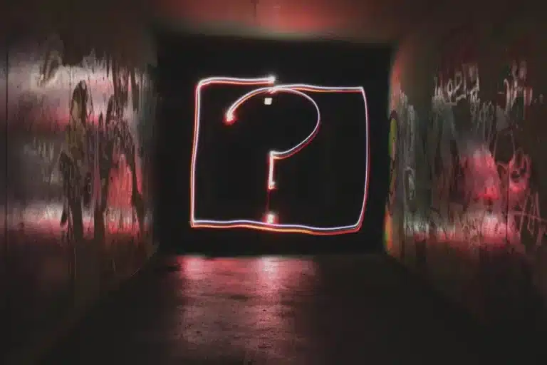 Participant recruitment concept - an illuminated rectangle and question mark on the far wall of a darkened room