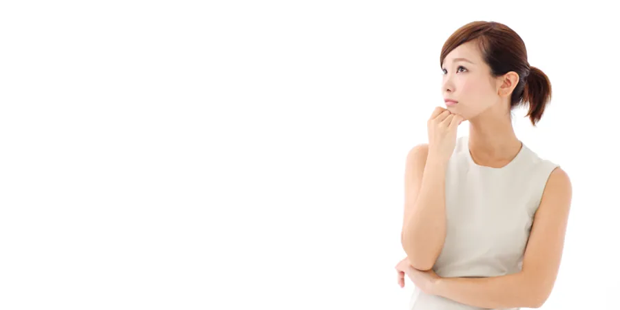 Asian woman in white dress looking puzzled as she wonders about the meaning of a market research term